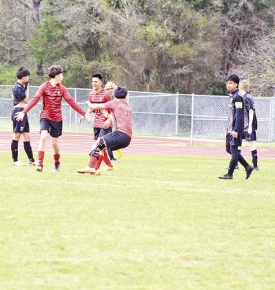 From left, Chapel Hill’s Rodrigo Olvera celebrates with Omar Morales and A.J. Ramirez following Olvera’s goal during the Red Devils’ game against Sulphur Springs Saturday afternoon. The Devils scored twice in the second half but fell against the Wildcats, 4-2. The Devils traveled to Liberty-Eylau Tuesday and will play their home finale Friday against Pleasant Grove before concluding their season next Tuesday at Paris. TRIBUNE PHOTO / QUINTEN BOYD