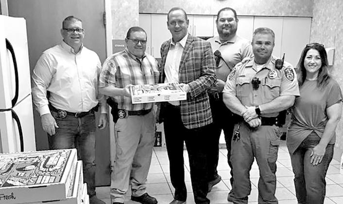 Titus County Judge Kent Cooper recently provided the men and women of the Titus County Sheriff’s Department with pizza from Luigi’s Restaurant to commemorate Law Enforcement Appreciation Week. Sheriff Tim Ingram said TCSO will receive pizza at different times and days to accommodate the various shifts. COURTESY PHOTO