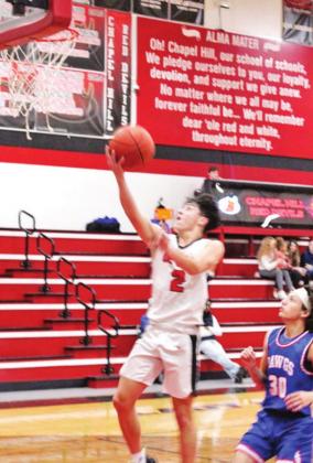 Adrian Ramirez puts up a shot during Tuesday’s game. Ramirez scored six in the Red Devils’ win over Quitman. TRIBUNE PHOTO / QUINTEN BOYD