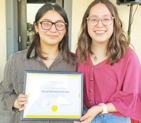 Brenda Godoy (right), a previous NTCC Jack Kent Cooke transfer scholarship winner, presents a certificate to Aaliyah Avellaneda, who recently learned she is a winner of the same award. COURTESY PHOTO