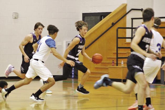 CHAAMP guard John Luke Angier pushes the ball up the court for a fastbreak after stealing the ball. Angier finished the game with a team high 10 steals. COURTESY PHOTO