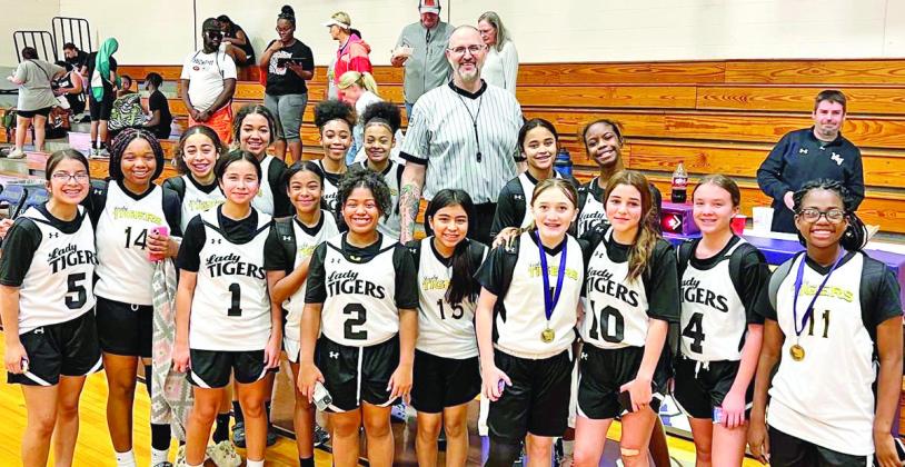 The MPJH 7th grade A team with former NBA Player, Greg Ostertag, of the Utah Jazz. COURTESY PHOTO