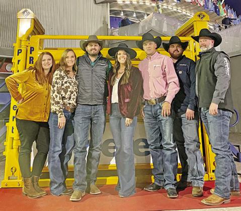 The Priefert Crew poses beside a bucking chute outside the Thomas and Mack Center as they prepare for NFR activities and competitions. COURTESY PHOTO