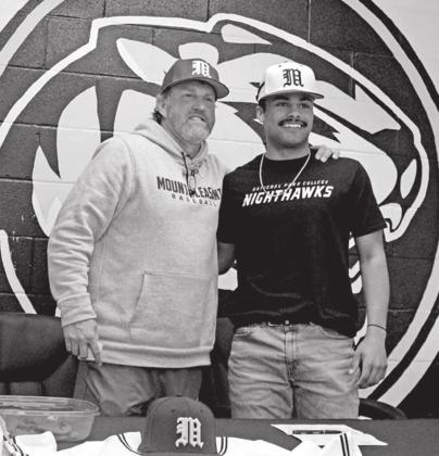 Mount Pleasant’s Evan Grissom signed his National Letter of Intent to play baseball at National Park College in Hot Springs, Ark. Grissom is pictured with Tiger baseball Head Coach Tommy Stewart. TRIBUNE PHOTO / QUINTEN BOYD