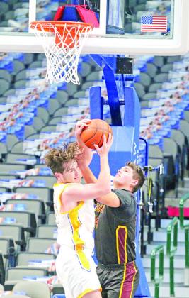 Harts Bluff’s Hunter Green battles for a rebound during Wednesday’s Court of Dreams game at Dallas’ American Airlines Center. The Bulldogs fell just short against McLeod, 5352.
