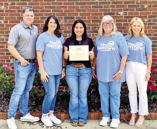 Titus County Cares awards Mrs. Beverly Eversole scholarships