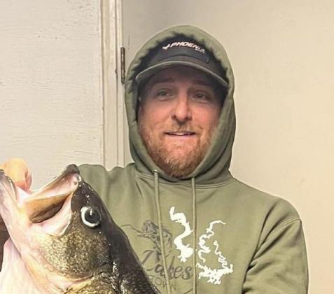 Fishing guide Jason Conn of Alba with the 17.03 pound giant he caught on February 13 at Lake O.H. Ivie. It’s the 8th largest bass ever caught in Texas and falls just short of the 17.06 pound lake record caught in February 2022 COURTESY PHOTO / JASON CONN