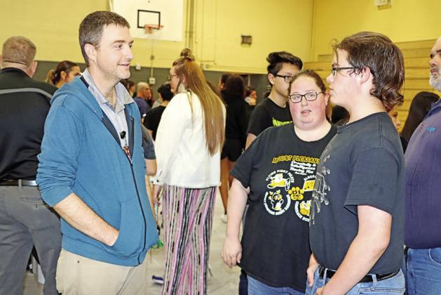 MPHS teacher, Jack Jones (left), answers an eighth grader’s questions about the MPHS Engineering program