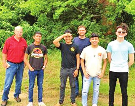 Stephen Borkowski with NTCC Honors Research Team outside of what used to be downtown Leesburg, where Shelby shopped. Also shown are honors students: Victor Diaz, Israel Perez, Evan Sears, John Rodriguez, and Cade Bennett. One can barely see what was once a brick mercantile, now hidden by trees to the right.