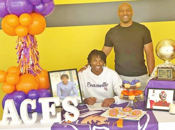 Zaveion Chism-Okoh signs his national letter of intent along with Mount Pleasant head basketball coach Joey Chism. PHOTO BY MELBARNEE CHISM-AUTRY