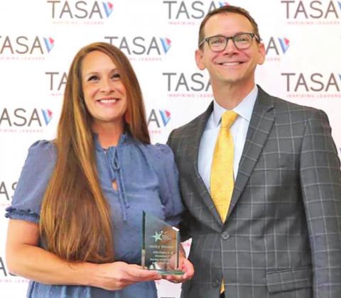 Shelley Bloomer stands proudly with Commissioner Morath of TASA after receiving her award at the 2021 TASA/TASB Convention. COURTESY PHOTO