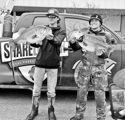 Dalton Smith (left) and Caden Cowan with their two Legacy Lunkers weighed just minutes apart on February 2 at Lake O.H. Ivie. Both anglers used forward-facing sonar to locate and catch their fish. It’s Smith’s third FFS 14 pounder since December 30. (TPWD Photo)