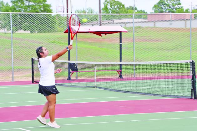Galilea Torres smashes an overhead winner in her singles match against Marshall COURTESY PHOTO / HUNTER MCGEE