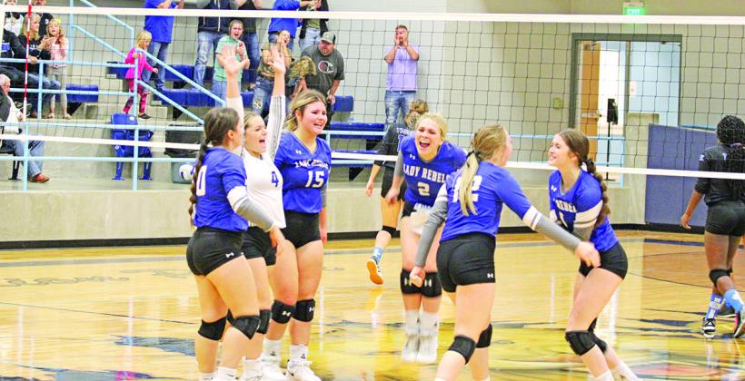 The Lady Rebels celebrate following match point of their bi-district round matchup against Linden-Kildare Tuesday. From left are Stoney Carey, Logan Huddleston, Elizabeth Langehennig, Vivian Hines, Anna Duvall and Emma Johnson.
