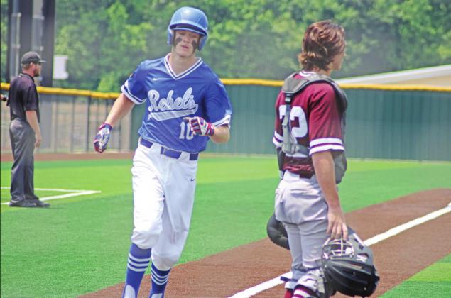 Dylan Earley crosses home plate for a Rivercrest run during game three of their series against Maud. Rivercrest won game three, 12-2, and won the series, 2-1.