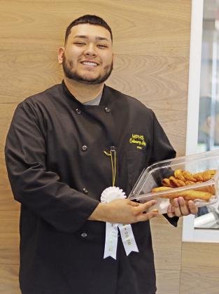Delfino Hernandez and his state award winning Garlic and Herb Bread and Breadsticks COURTESY PHOTO