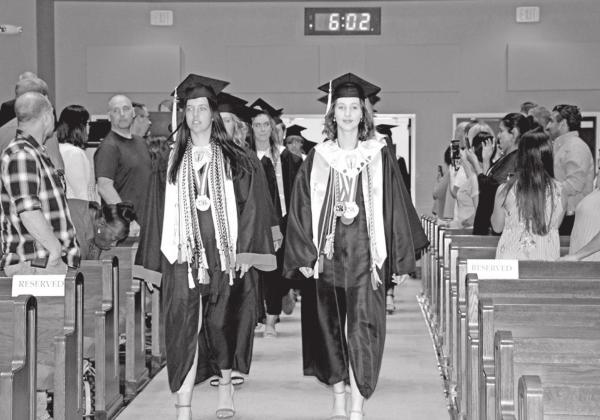 Chapel Hill Salutatorian, Presley Applegate, and MPHS Valedictorian, Connelly Cowan, lead the graduates into the sanctuary. COURTESY PHOTO