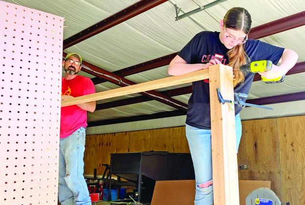 Harley Stegall working on her AG Mechanics from Chapel Hill FFA TRIBUNE PHOTO / RYLEIGH STEGALL