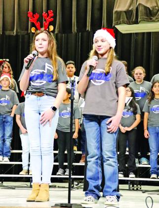 Lankston Holderness and Macie Butler singing “New Kid in Town.” 6th grade