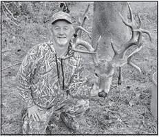 Montgomery archer Everett Sunday arrowed his gnarly 18 pointer shortly after daylight on 200 acres in Houston County. Sunday believes the the 5 1/2-year-old buck had been brawling with another buck before it charged out of a yaupon thicket on the heels of a 10 pointer. The archer drilled the buck at 15 yards. COURTESY PHOTO / EVERETT SUNDAY