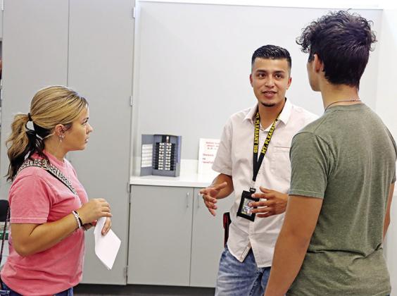 MPHS Electrical Technology teacher, Alan Salinas, tells a student and parent what they will be learning this year.