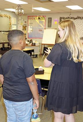 Fowler teacher, Allyson Ingram, talks with a new student.
