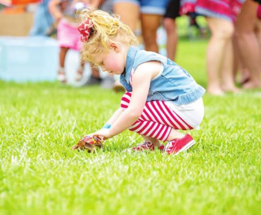 Happy Birthday USA provides fun for all ages. Pictured above is a participant in last year’s turtle races.