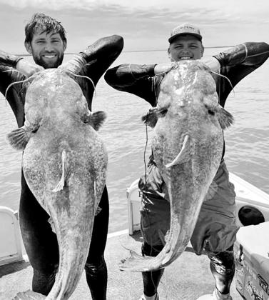 Moore and White have been fishing together for five years and have noodled multiple fish in the 50-80 pound range. They say teamwork is a virtue in the sport of noodling. COURTESY PHOTOS