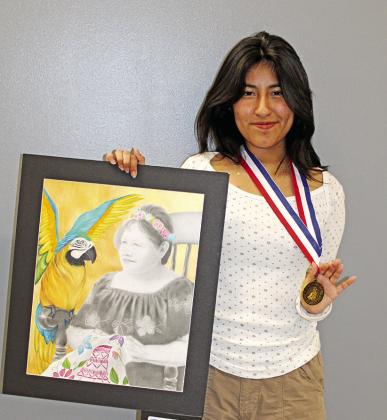 Josue Vega with his state medal piece, “Cowboys” Stephanie Hernandez with her state medal piece, “Eternal Youth”