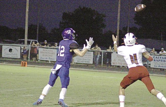 Rivercrest’s Mark Grider catches a pass during a recent game. Grider had a 62-yard touchdown reception in the Rebels’ 27-14 win at Quinlan Boles. Rivercrest takes on Wolfe City at The Swamp Friday for third place in district. TRIBUNE PHOTO / QUINTEN BOYD