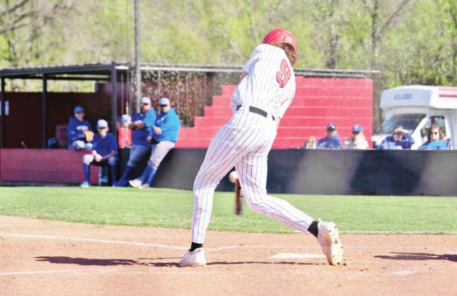 Bryce Wertz makes contact during last week’s game against Quitman. The Red Devils defeated the Bulldogs, 5-3. COURTESY PHOTO