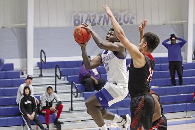 Pewitt’s Kei’drick Hawkins drives for a layup during Friday’s game against Queen City. The Brahmas fell to the Bulldogs, 49-46.