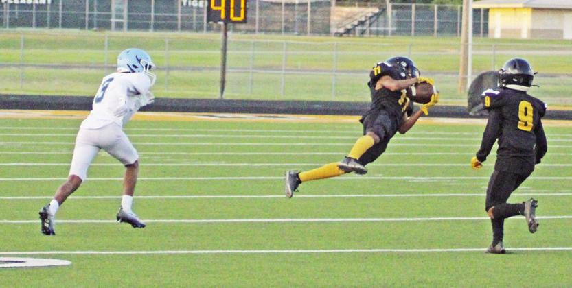 Mount Pleasant’s Dexter King lays out to make a catch during last week’s game against Frisco Emerson.