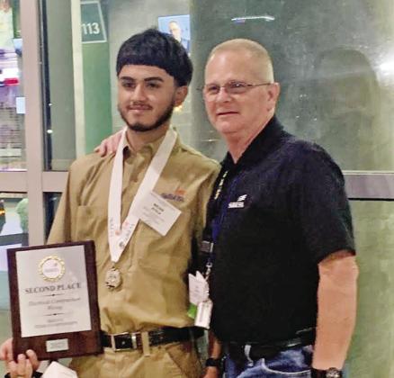 Brian Ayala (left) and MPHS Electrical Technology instructor Tim Davis (right) COURTESY PHOTOS
