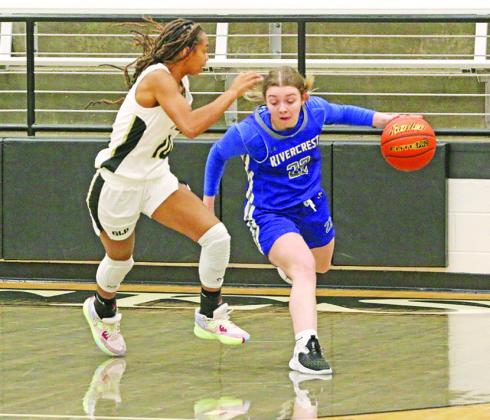 Rivercrest’s Anna Duvall looks to get around Pittsburg’s Breana Clark during Monday’s game. The Lady Rebels claimed third place at the North Hopkins Tournament, but fell on the road to the Lady Pirates. TRIBUNE PHOTO / QUINTEN BOYD