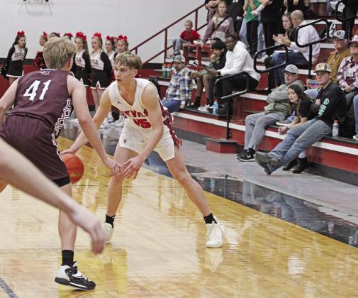 TRIBUNE PHOTO / QUINTEN BOYD Chapel Hill’s Braden Buchanan sets up the offense during a recent game. The Red Devils played in Tyler against All Saints Tuesday and will take part in the Edgewood Basketball Invitational this weekend.