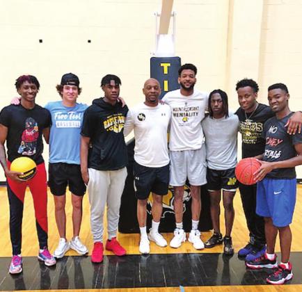 Former Tiger basketball players returned to serve their community. Pictured L-R: Zaveion Chism-Okoh, Brock Cooper, Xzavier Brown, Coach Joey Chism, Christon Himes, Jakybrein Hines, Devin Williams, Josh McGill