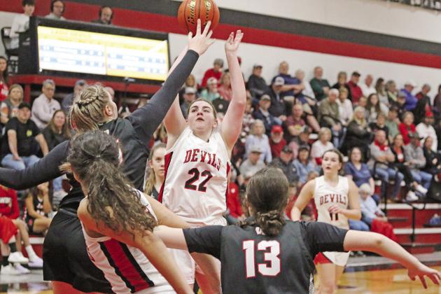 Chapel Hill’s Abigail Thrapp puts up a shot over Winnsboro’s Faith Acker during Tuesday’s game. The 18th-ranked Lady Raiders picked up the win over the 11th-ranked Lady Devils, 49-38.