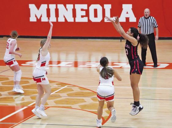Mackenzie Espinosa puts up a three-pointer during Friday’s game at Mineola.