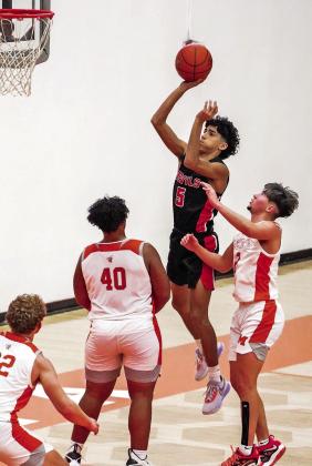 Cayden Martinez floats to the basket during Friday’s game at Mineola. COURTESY PHOTOS