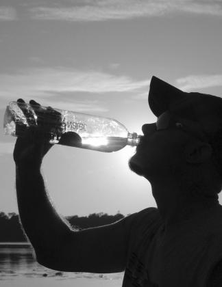 Keeping your body hydrated is important. Always carry plenty of cold water when working or playing outdoors during the summer heat. More importantly, make a point to drink it periodically, even if you aren’t thirsty. PHOTO BY MATT WILLIAMS