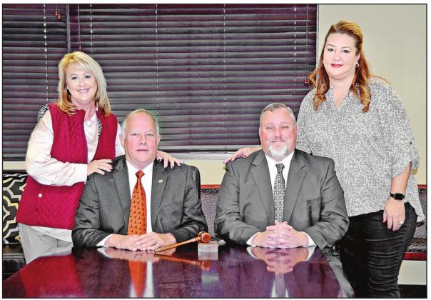 Pictured with their wives, First Federal Community Bank long time President Richard M. “Dick” Amis and Brad Meyers, a seven year employee of the Bank who has now been named President and Chief Executive Officer. Amis will continue as the bank’s Chairman of the Board. COURTESY PHOTO