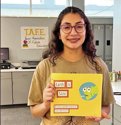 Gabby Garza with her state advancing children’s book. COURTESY PHOTOS