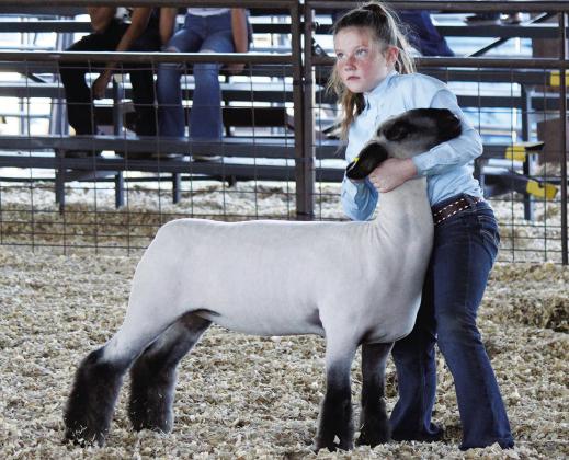 Cali Derrick with her Breeding Ewe was one of the many who showcased their talents at this year’s Titus County Fair. Her photo was incorrectly identified in our last issue. We regret the error and congratulations to Cali. See more pictures from the fair on Page 7.
