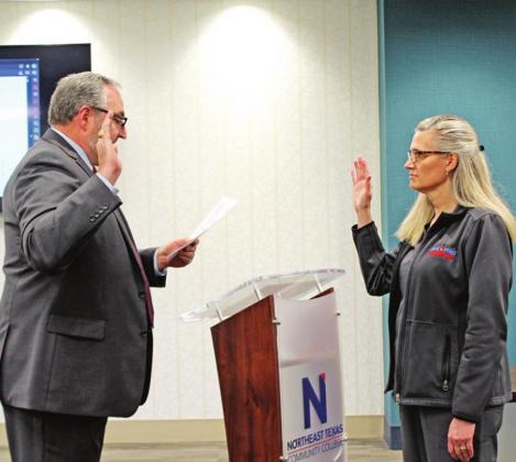 Stephanie Thurman (right) was re-elected for Place Five on the board, and sworn in by County Judge AJ Mason (left).