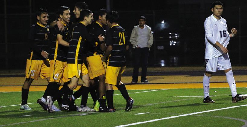 The Mount Pleasant Tigers celebrate after John Zelaya’s goal that would be the game winner in their matchup with Pine Tree. PHOTO BY QUINTEN BOYD