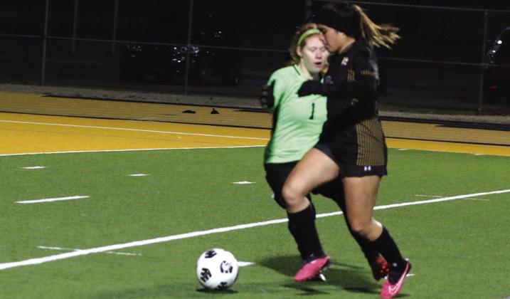 Karina Torres makes her way past Texas High goalkeeper Kaylee Norton on her way to scoring her second goal in Mount Pleasant’s 4-0 win. PHOTO BY QUINTEN BOYD