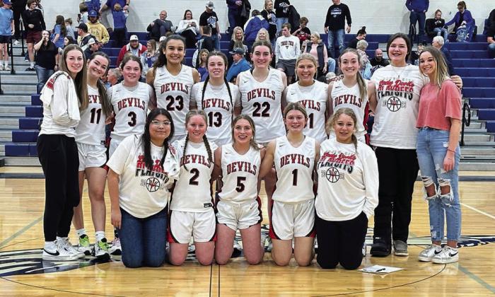 The 2022 Chapel Hill Lady Devils pose victorious after a 59-27 win over the Hooks Lady Hornets Monday night that earned them a Bi-District Championship and pushed them on to the next round of the basketball playoffs. COURTESY PHOTO