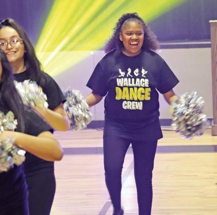 3rd period dance class members Ashley Chavez (left) and Madison Cheatum (right) perform their class dance
