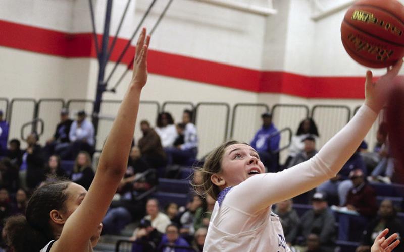 Anna Duvall drives for a layup during Friday’s district playoff against Clarksville. The Rivercrest Lady Rebels took on Quinlan Boles in the bi-district round Monday evening. PHOTO BY QUINTEN BOYD